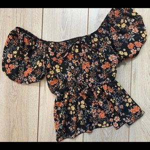 On the shoulder or off the shoulder black floral top. All items are new